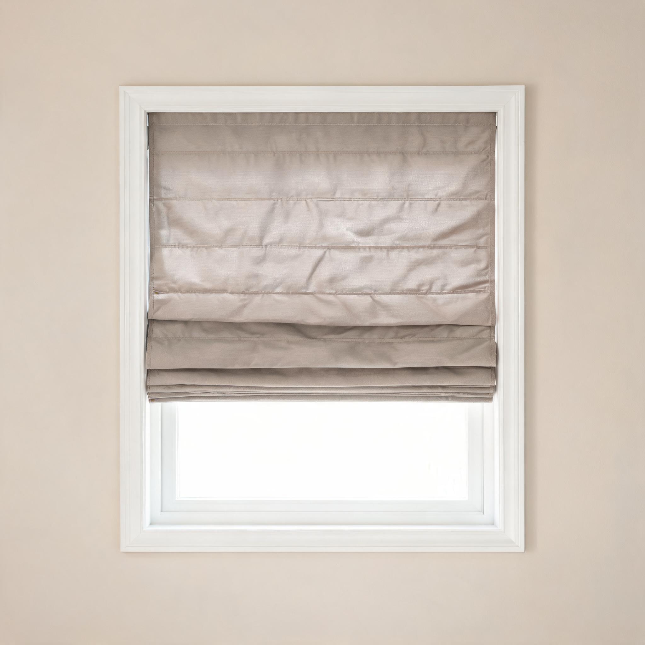 Roman shade in soft taupe linen.